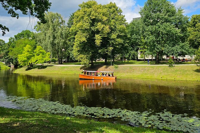 Riga Canal and Daugava Boat Tour with Welcome Drink & Audio Guide - Key points at a glance