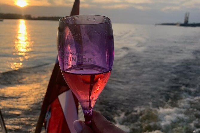Riga: Evening or Sunset Boat Tour with Drink and Audio Guide - Starting at Andrejosta Marina