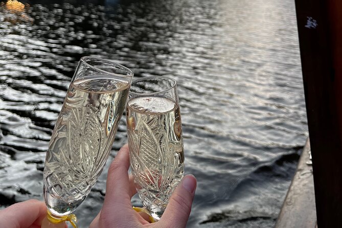 Riga: Evening or Sunset Boat Tour with Drink and Audio Guide - Choosing Sunset or Night