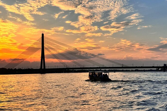 Riga: Evening or Sunset Boat Tour with Drink and Audio Guide - What the Audio Guide Adds