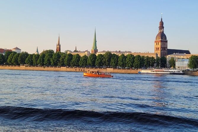 Riga: Evening or Sunset Boat Tour with Drink and Audio Guide - Who Will Enjoy This Riga Boat Ride?